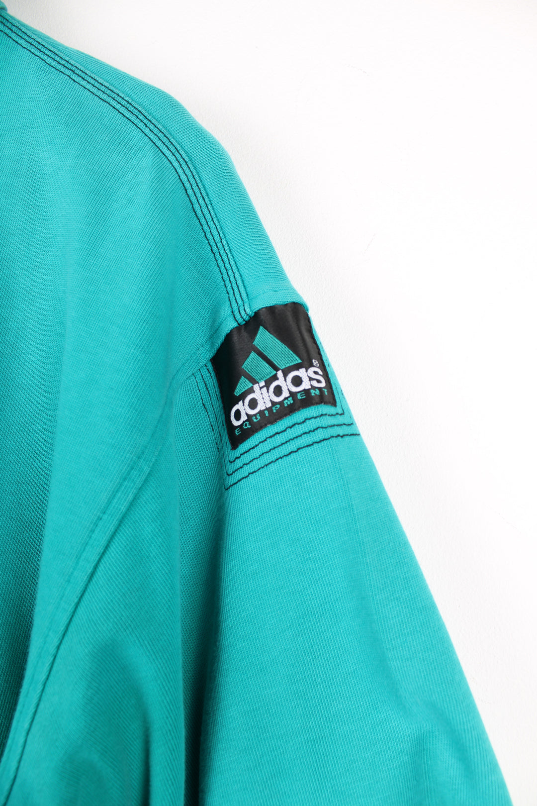 Vintage Adidas Equipment turquoise polo shirt with small embroidered logo on the chest and patch logo on the arm. good condition Size in Label: 42/ 44 - Measures like a mens L