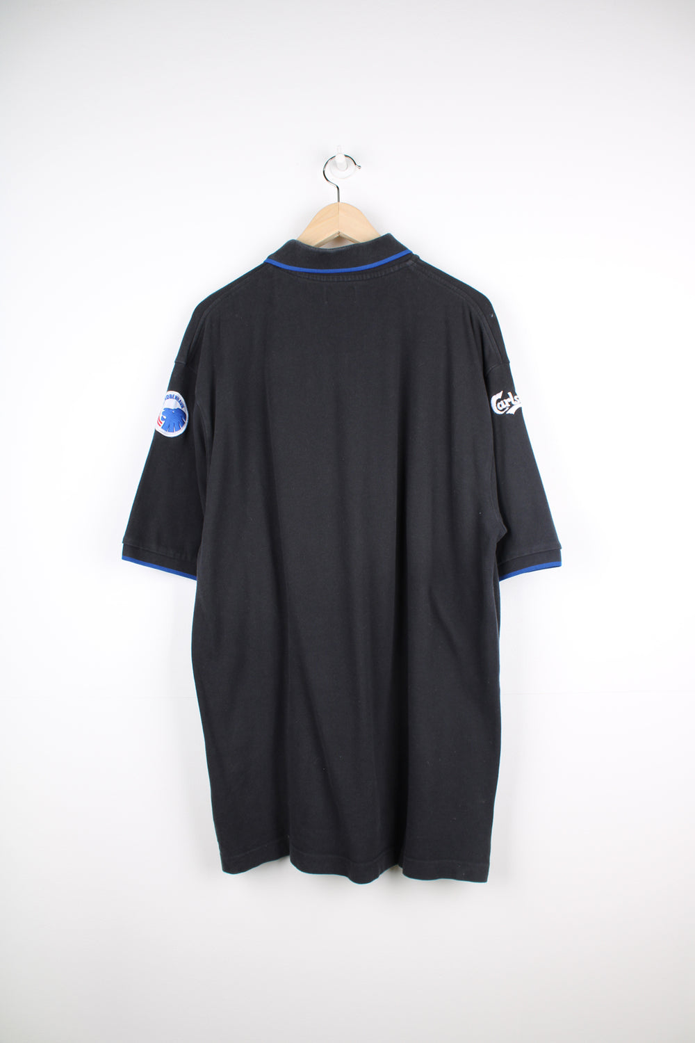 Vintage Kappa black polo shirt with embroidered Kappa logo on the chest and printed FCUK logo on the chest. Also features embroidered F.C. Københaven logo on one sleeve and Carlsberg logo on the other good condition Size in Label: Mens XXXLarge