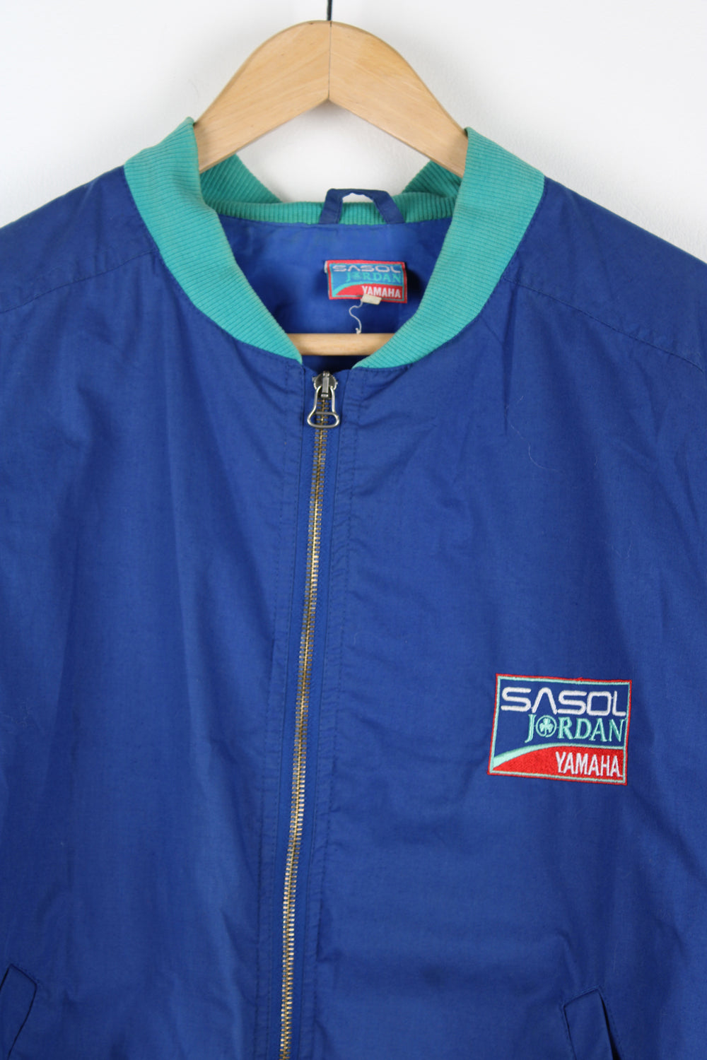 Rare vintage 1992 Sasol Jordan Yamaha blue cotton, zip through  racing jacket features F1 car Jordan 192 on the back