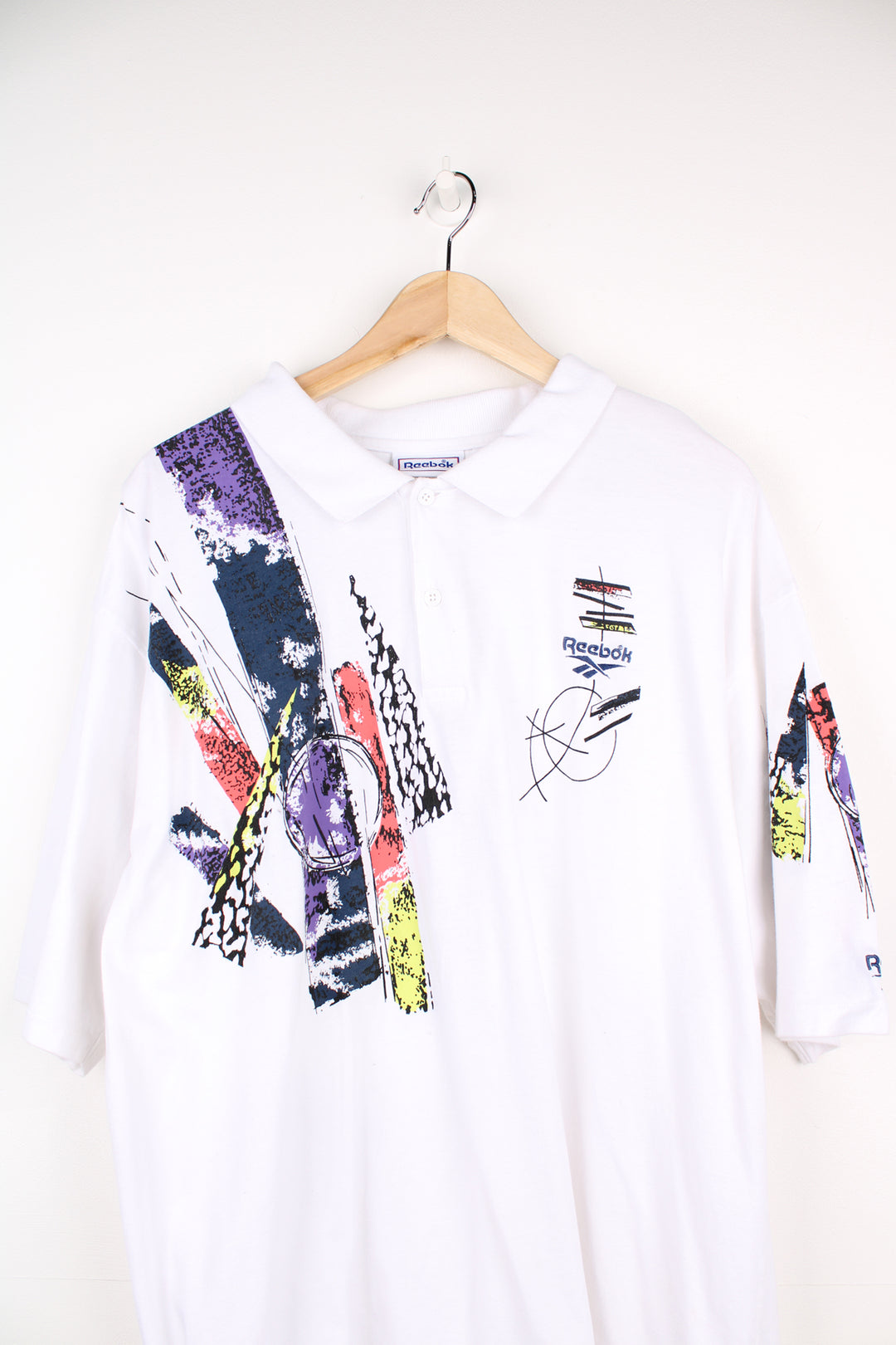 Vintage Reebok white polo shirt with abstract design on the front/ back and embroidered logo on the chest. good condition Size in Label: Mens XL