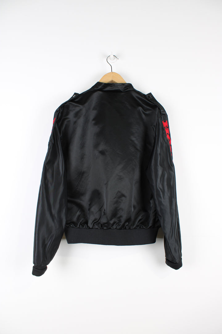 Vintage 1980's Honda black satin bomber jacket features embroidered spell-out details on the chest and down the sleeve 