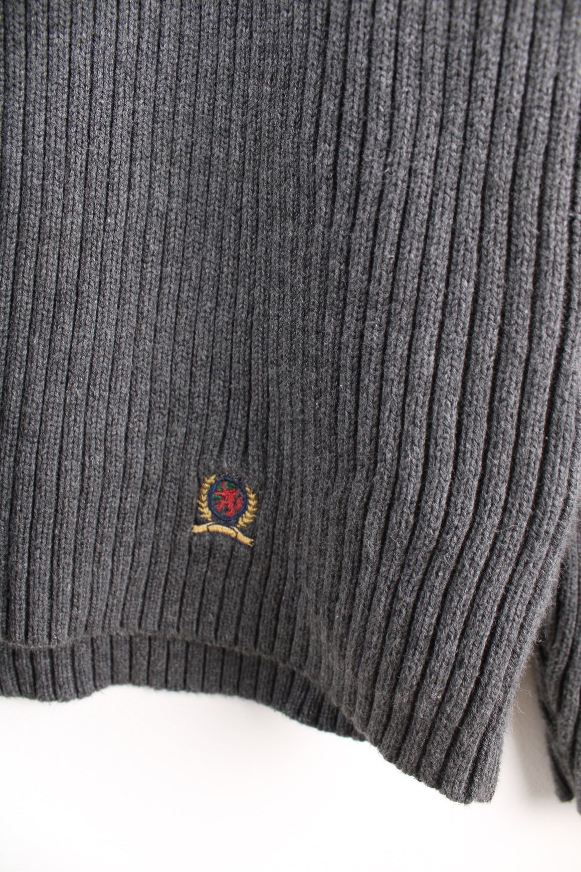 Tommy Hilfiger grey rib knit roll neck jumper. Features a horizontal darker grey stripe across the chest and embroidered logo on the hem. Made from a 100% cotton. good condition  Size in Label:  XL - Measures like a Mens M