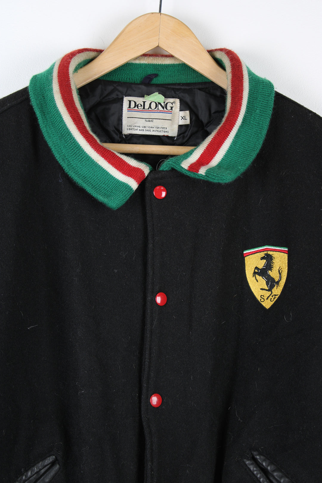 Vintage Ferrari themed black wool varsity jacket by Delong features embroidered badges on the chest and spell-out details across the back