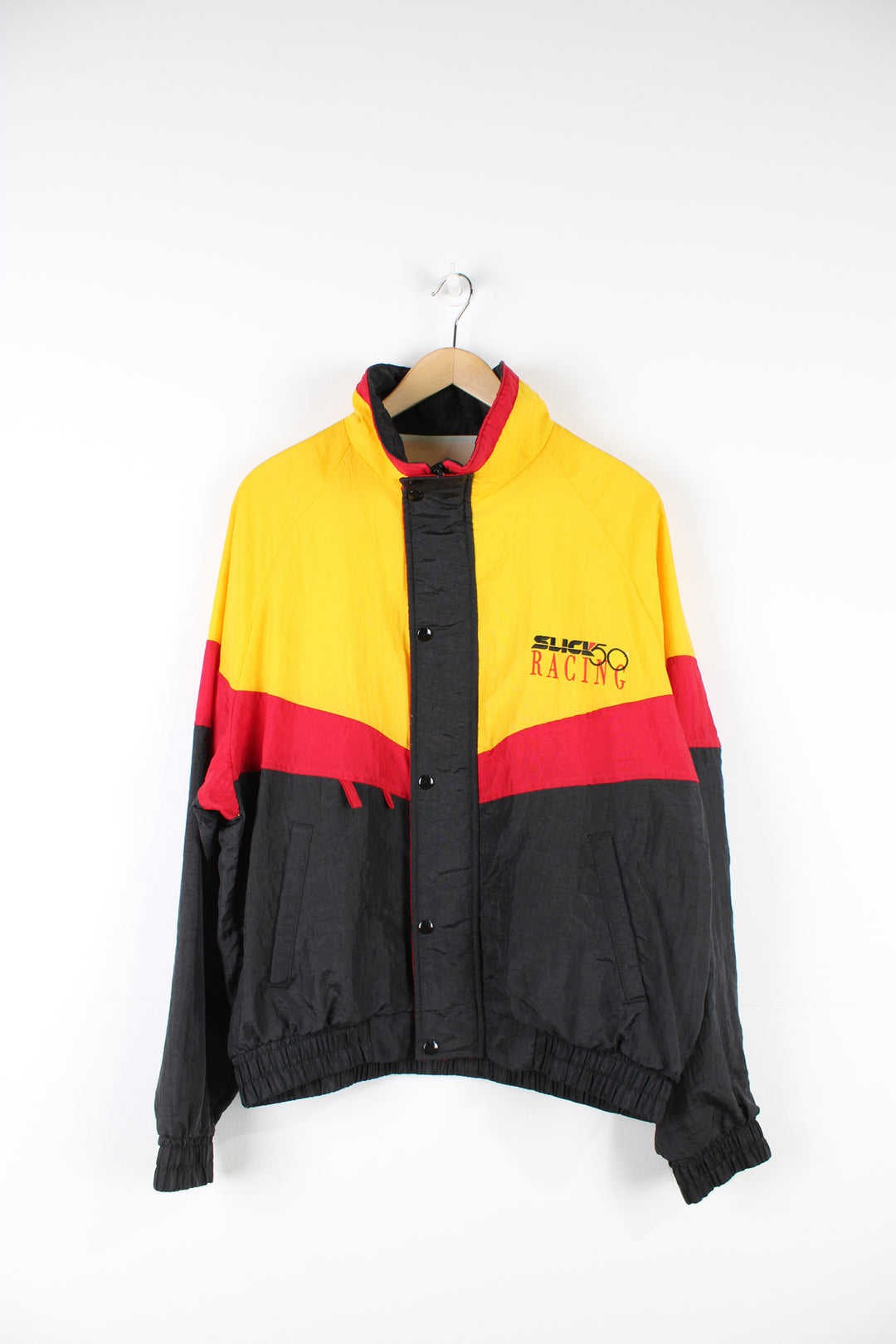 Vintage Slick 50 red, yellow and black shell cropped racing jacket. Features embroidered spell-out details on the chest and across the back of the shoulders