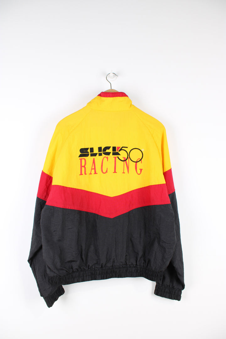 Slick Racing 50 red, yellow and black shell cropped racing jacket. Features embroidered spell-out details on the chest and across the back of the shoulders