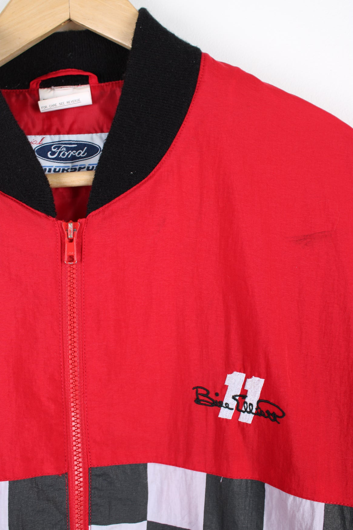 Vintage Budweiser x Bill Elliott red zip through, shell style racing jacket. Features embroidered badges/logos on the chest and checker board wrap around design 