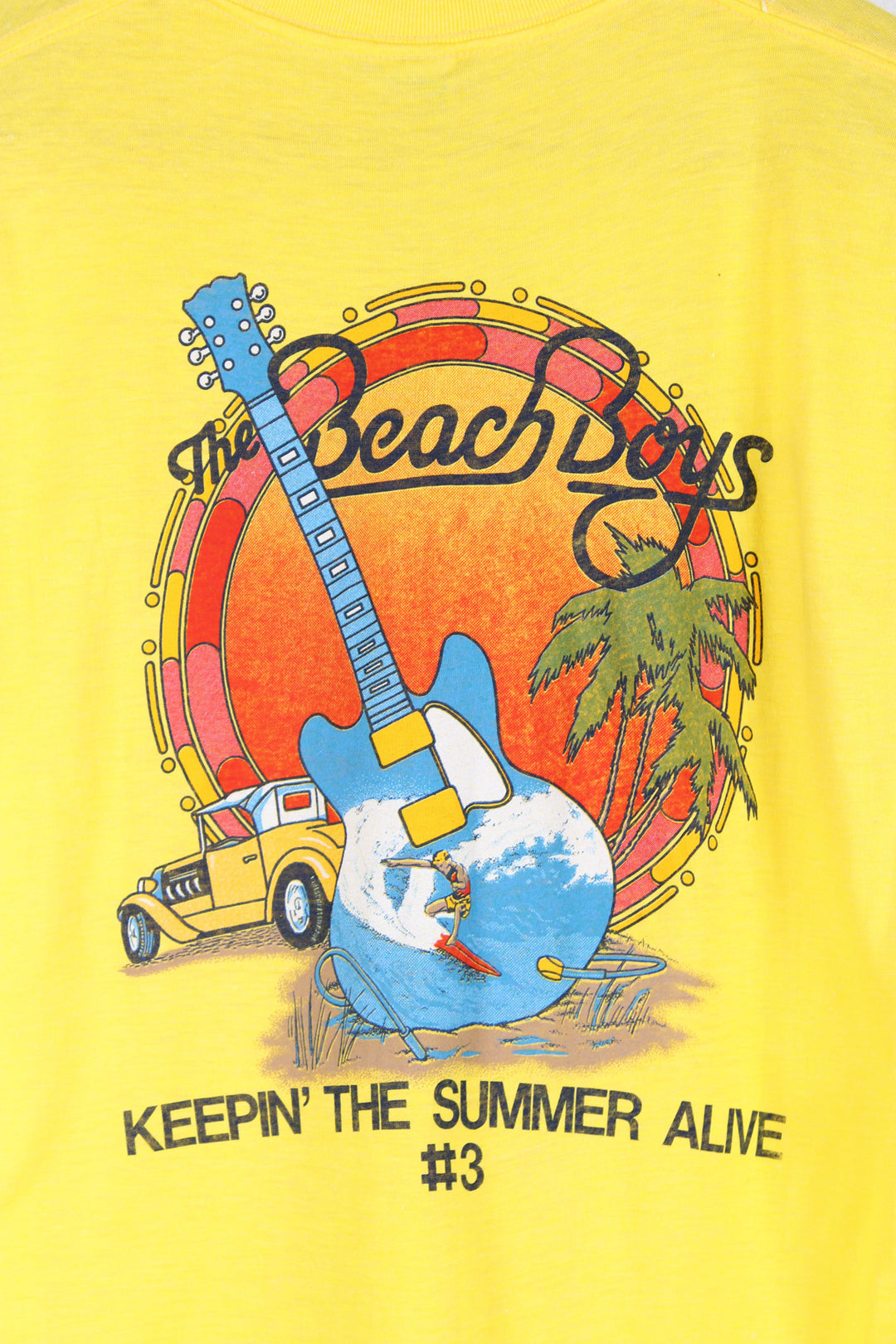 Vintage 1985 yellow Beach Boys convention t-shirt. Single stitch with design on the front and back. good condition  Size in Label:  Slim fit XL