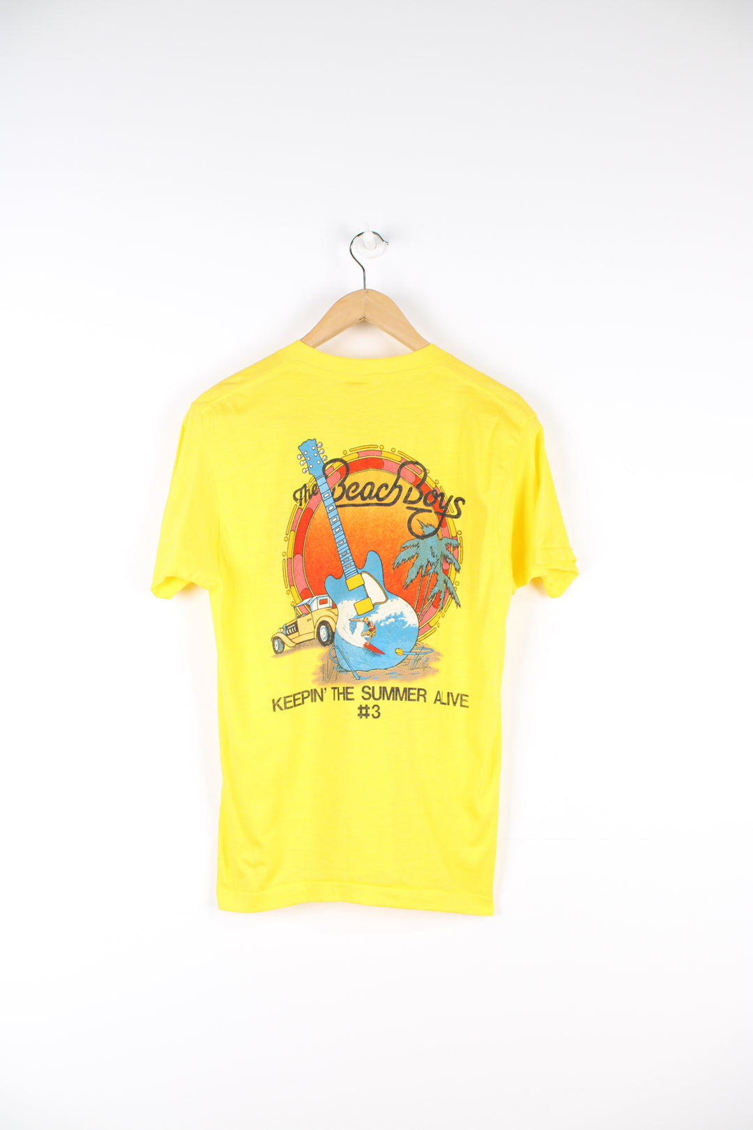 Vintage 1985 yellow Beach Boys convention t-shirt. Single stitch with design on the front and back.  good condition  Size in Label:  Slim fit L