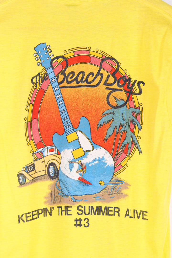 Vintage 1985 yellow Beach Boys convention t-shirt. Single stitch with design on the front and back.  good condition  Size in Label:  Slim fit L