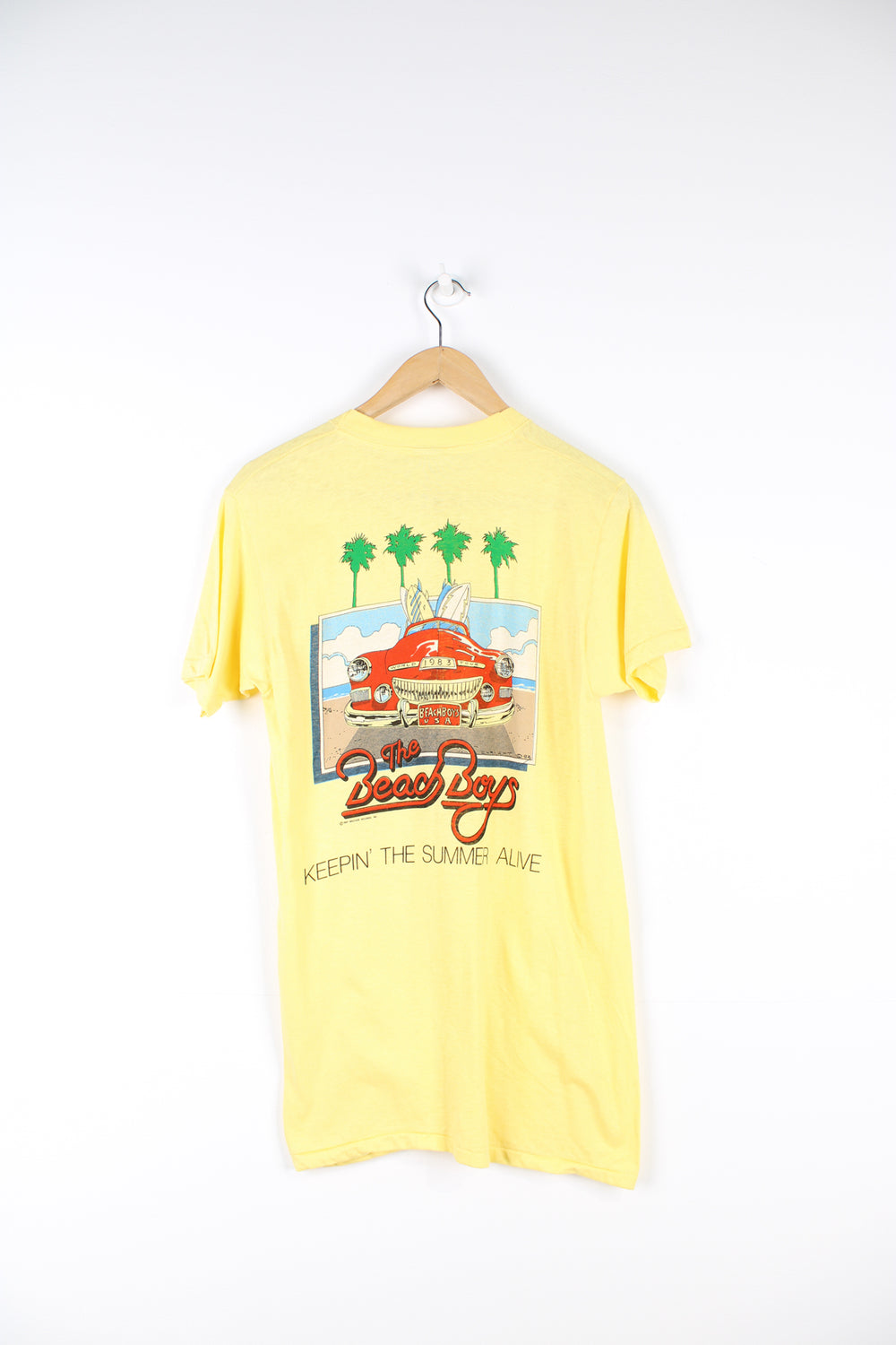 Vintage 1983 yellow Beach Boys convention t-shirt. Single stitch with design on the front and back.  good condition  Size in Label:  Slim fit M