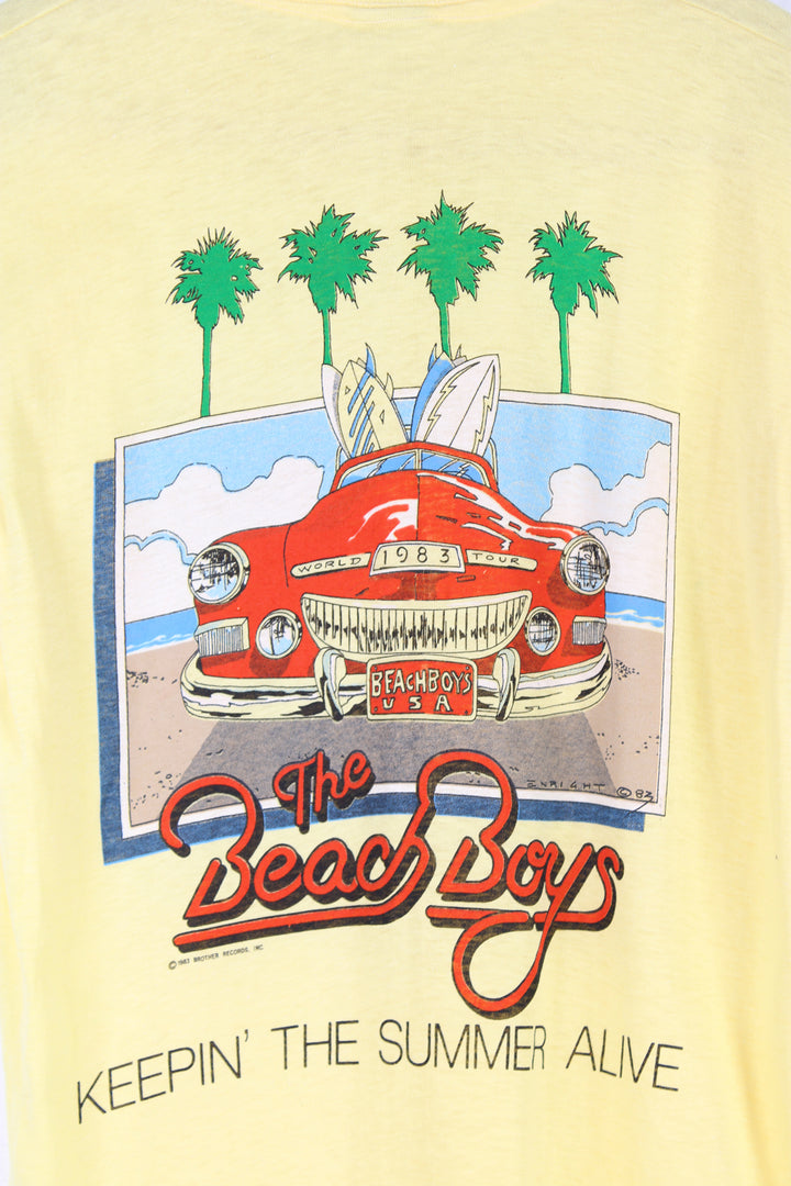 Vintage 1983 yellow Beach Boys convention t-shirt. Single stitch with design on the front and back.  good condition  Size in Label:  Slim fit M