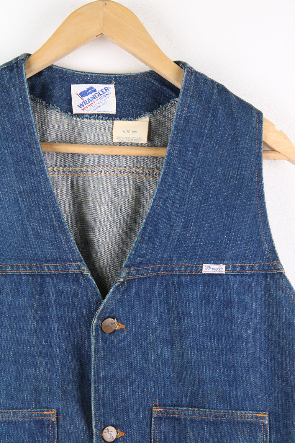 Vintage 1980's 'no fault' Wrangler denim vest in blue, button up with two pockets on the front and embroidered logo on the chest