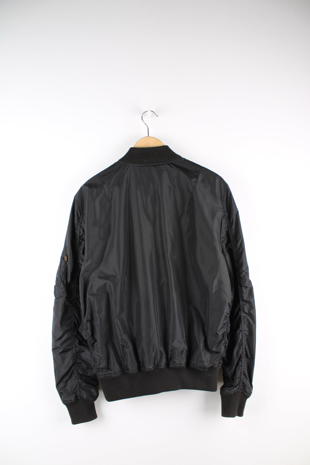 Vintage Alpha Industries bomber jacket in black, features multiple pockets