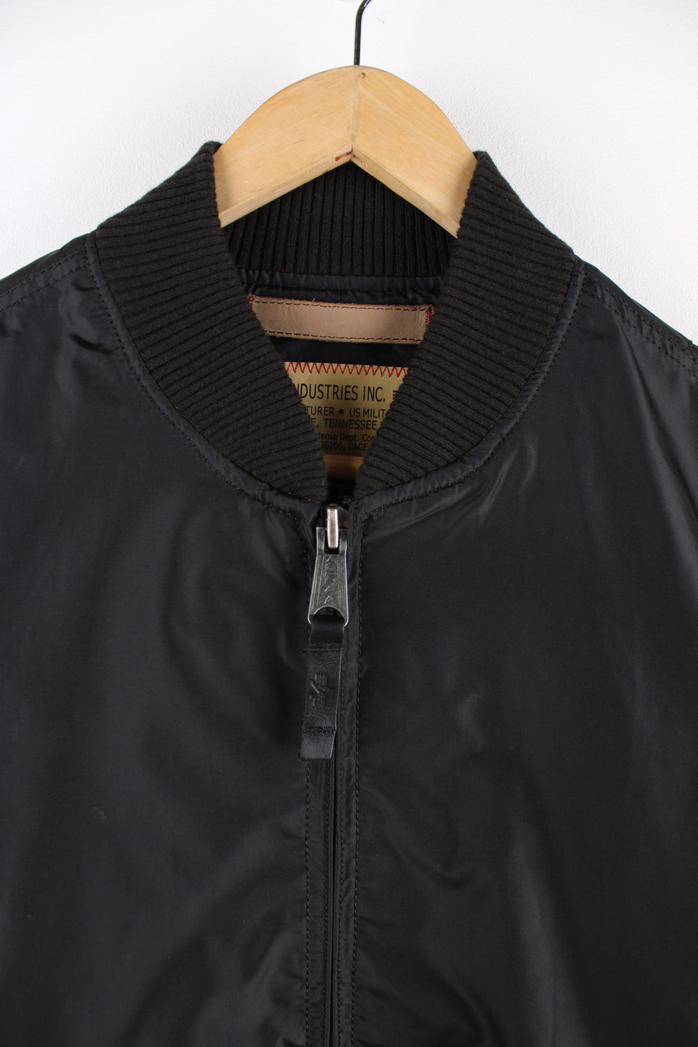 Vintage Alpha Industries bomber jacket in black, features multiple pockets