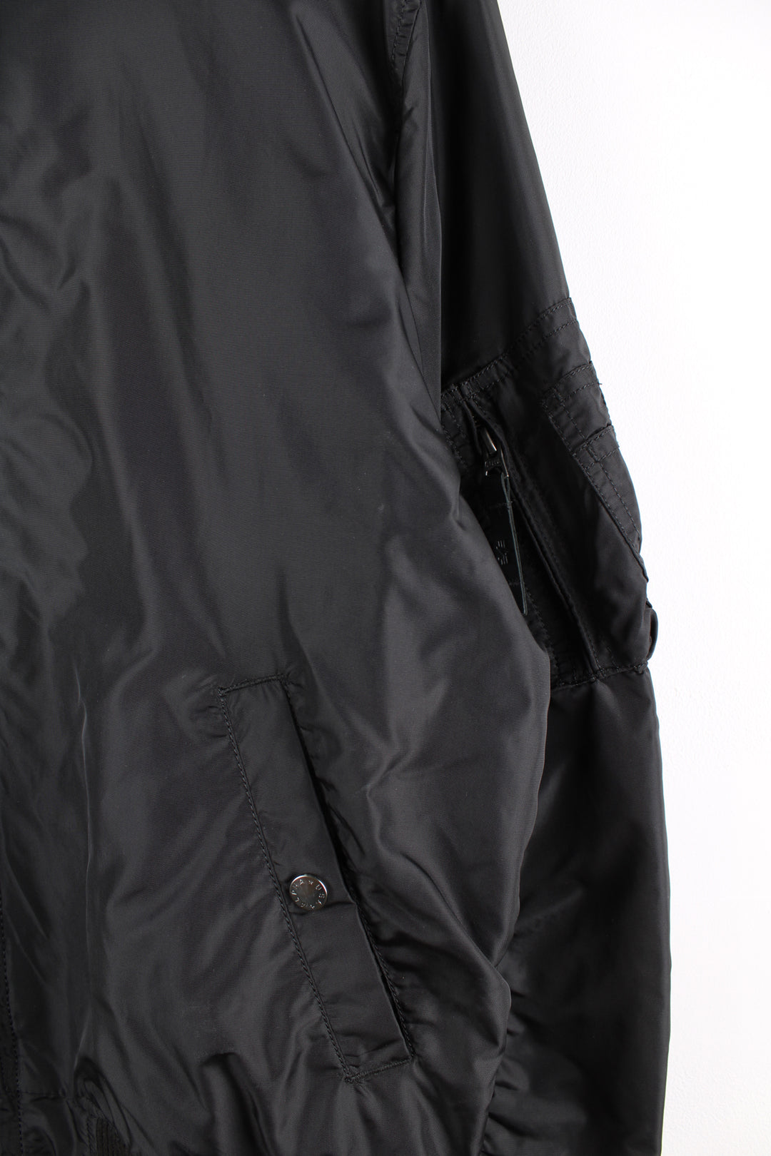 Vintage Alpha Industries bomber jacket in black, features multiple pockets