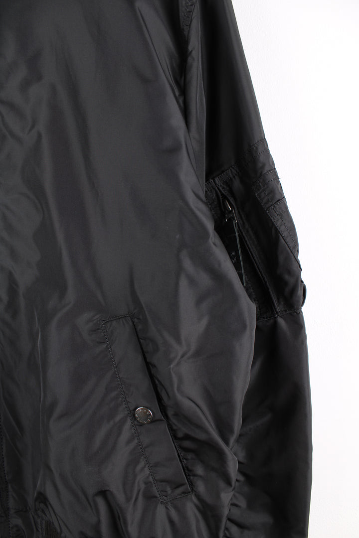 Vintage Alpha Industries bomber jacket in black, features multiple pockets