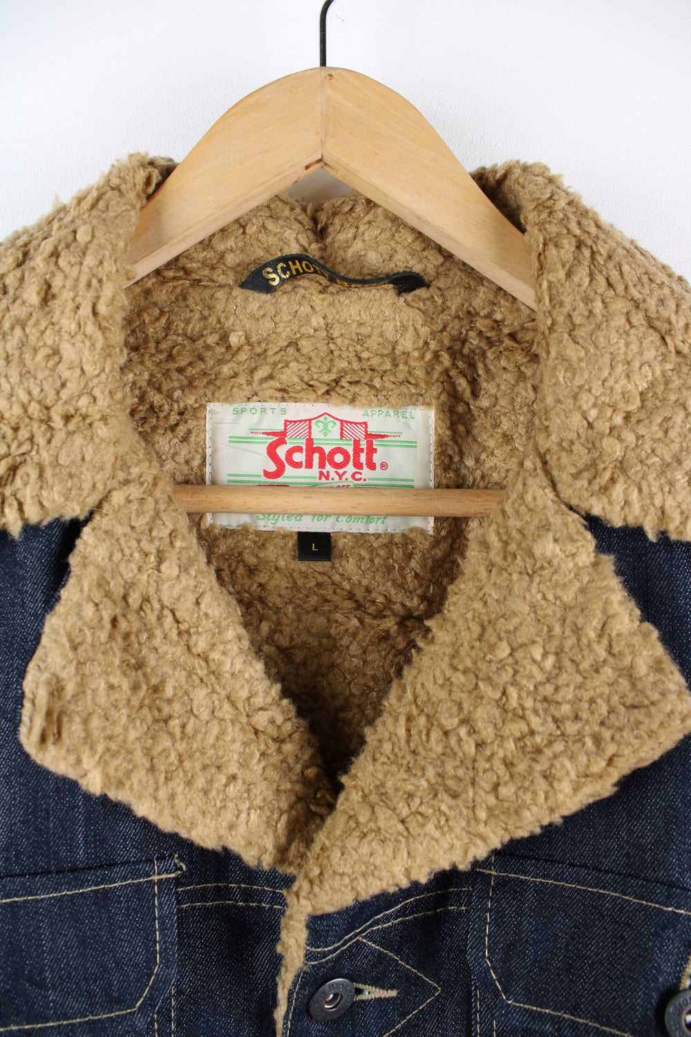 Vintage 00's Schott NYC denim chore jacket features shearling style lining and multiple pockets