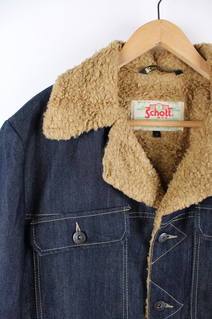 Vintage 00's Schott NYC denim chore jacket features shearling style lining and multiple pockets