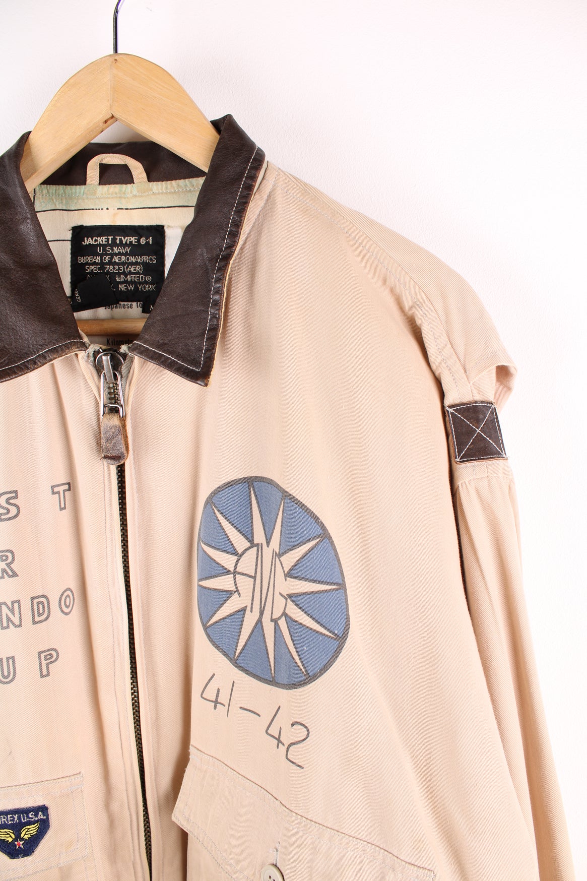 Vintage Avirex type G-1 tan cotton flight jacket with all over printed details and embroidered badge on the pocket