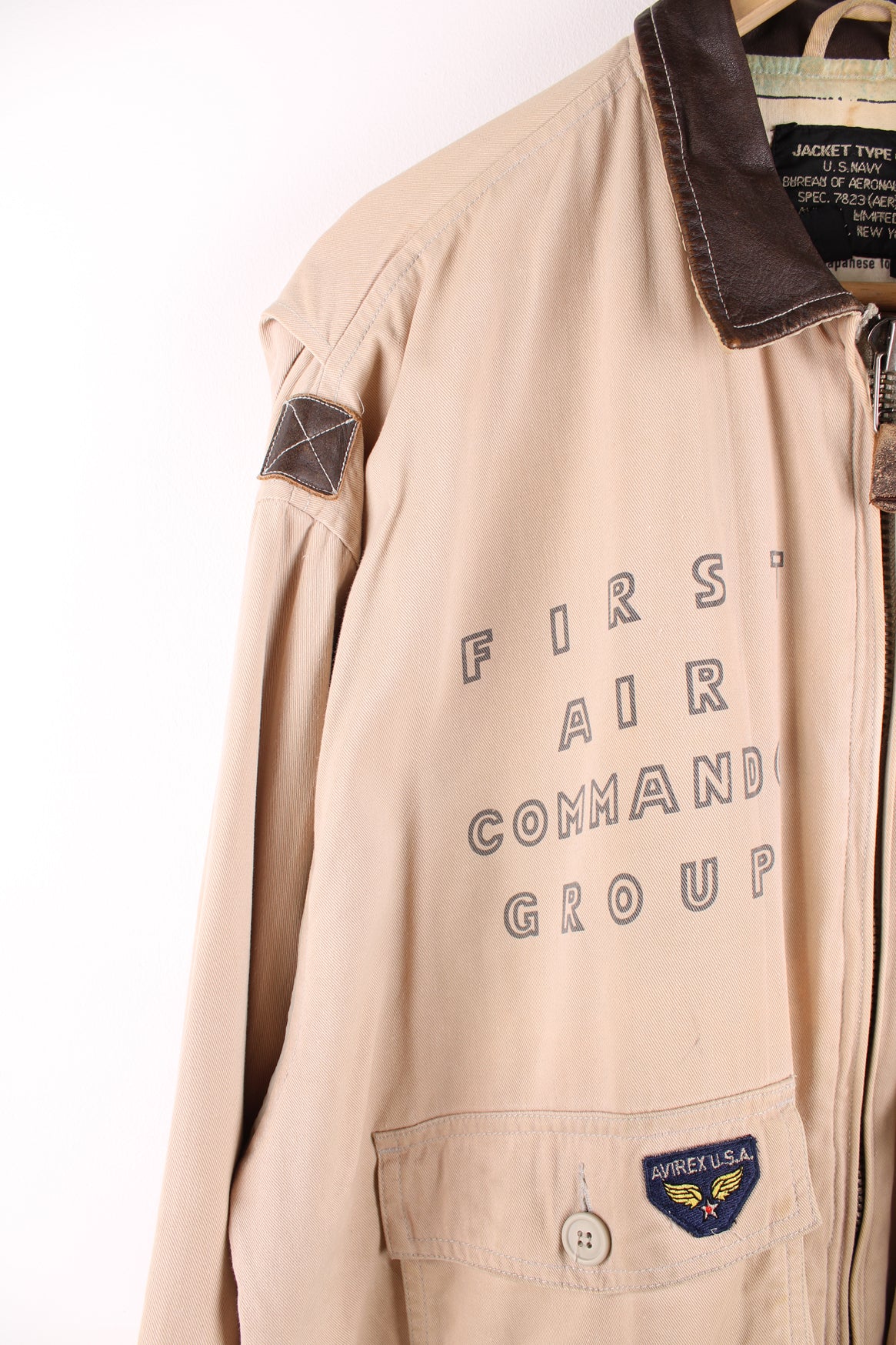 Vintage Avirex type G-1 tan cotton flight jacket with all over printed details and embroidered badge on the pocket