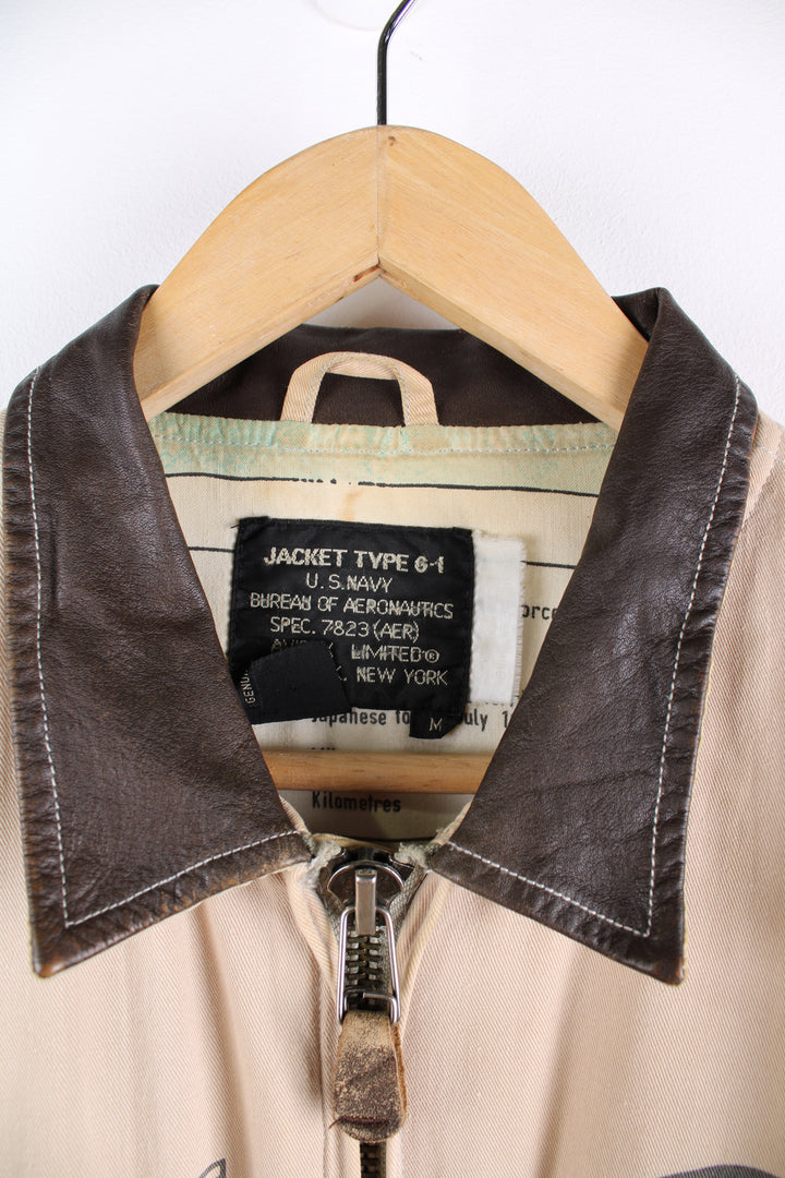 Vintage Avirex type G-1 tan cotton flight jacket with all over printed details and embroidered badge on the pocket