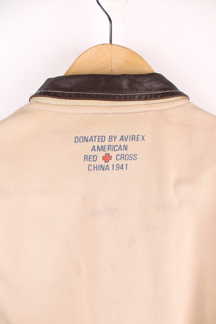 Vintage Avirex type G-1 tan cotton flight jacket with all over printed details and embroidered badge on the pocket