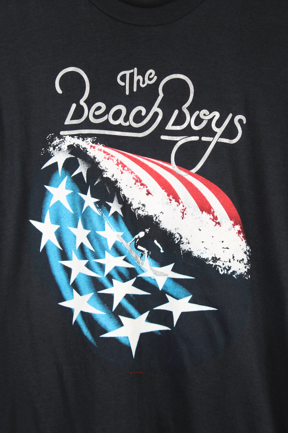 Vintage Beach Boys single stitch black t-shirt with printed design on the front.  good condition  Size in Label:  Slim fit XL