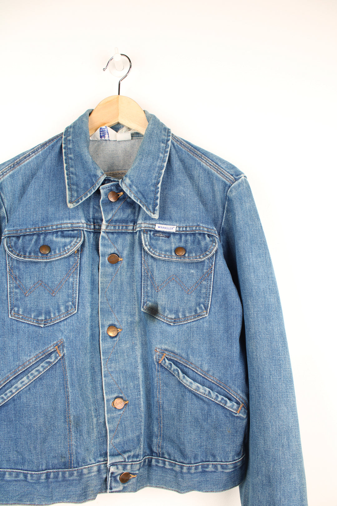 Vintage 70's  Wrangler 'no fault' 100% cotton denim jacket in blue with signature 'W' embroidered on the pockets and logo embroidered on the chest.  