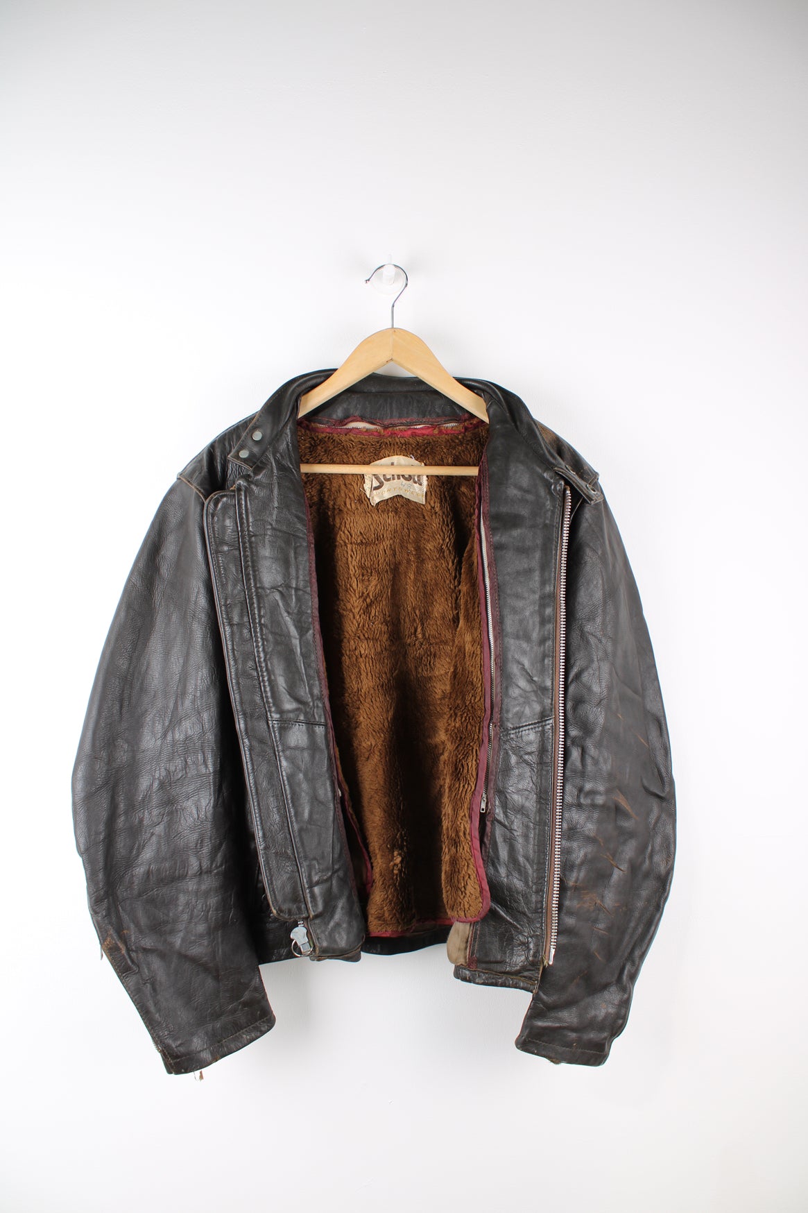 Vintage Schott NYC dark brown leather racer jacket, features removable liner, zip up pockets and adjustable buckles