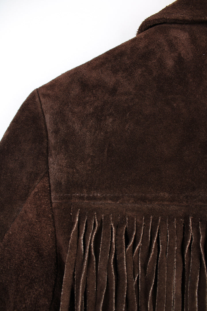 Vintage 1970s western style chocolate brown suede  jacket. Features belt, fringe detailing across the shoulders and down the sleeves and buttons for closure