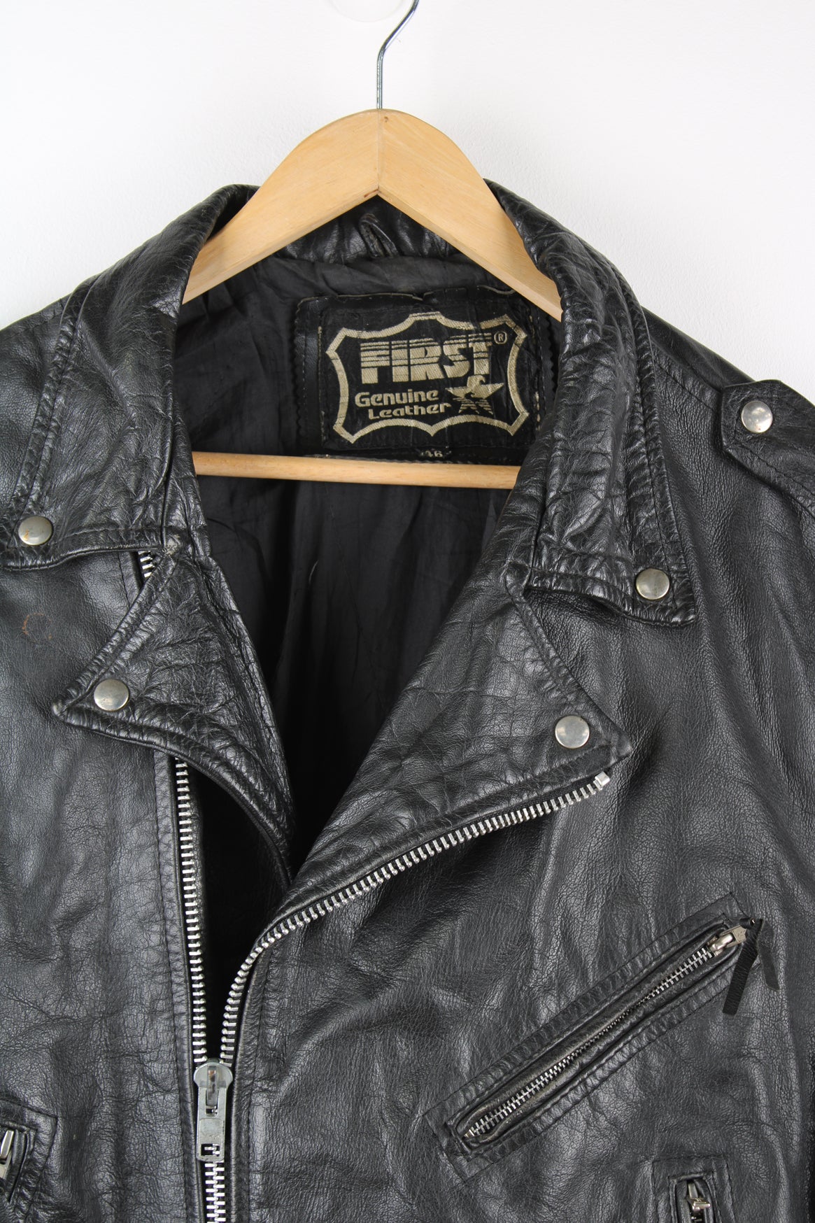 Vintage First biker jacket made from 100% genuine leather, features multiple zip up pockets, lace up details on the hips