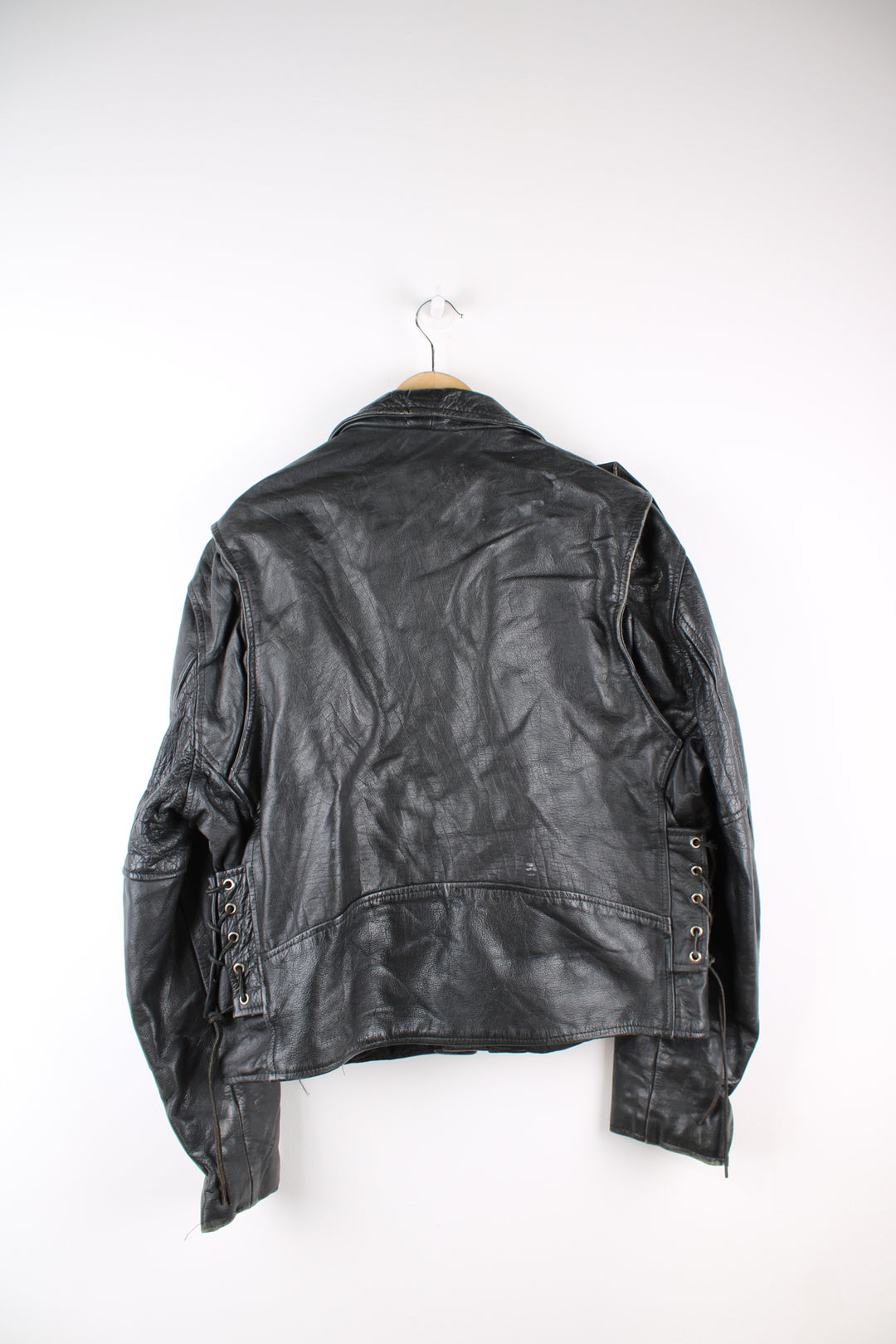 Vintage First biker jacket made from 100% genuine leather, features multiple zip up pockets, lace up details on the hips