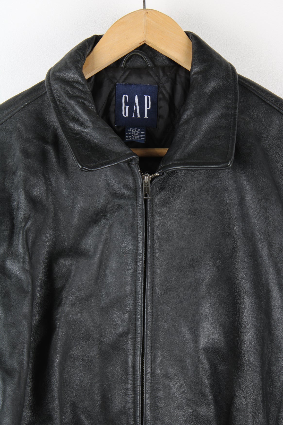 Vintage GAP all black zip through jacket, made from 100% leather. Features buckle details on the hips