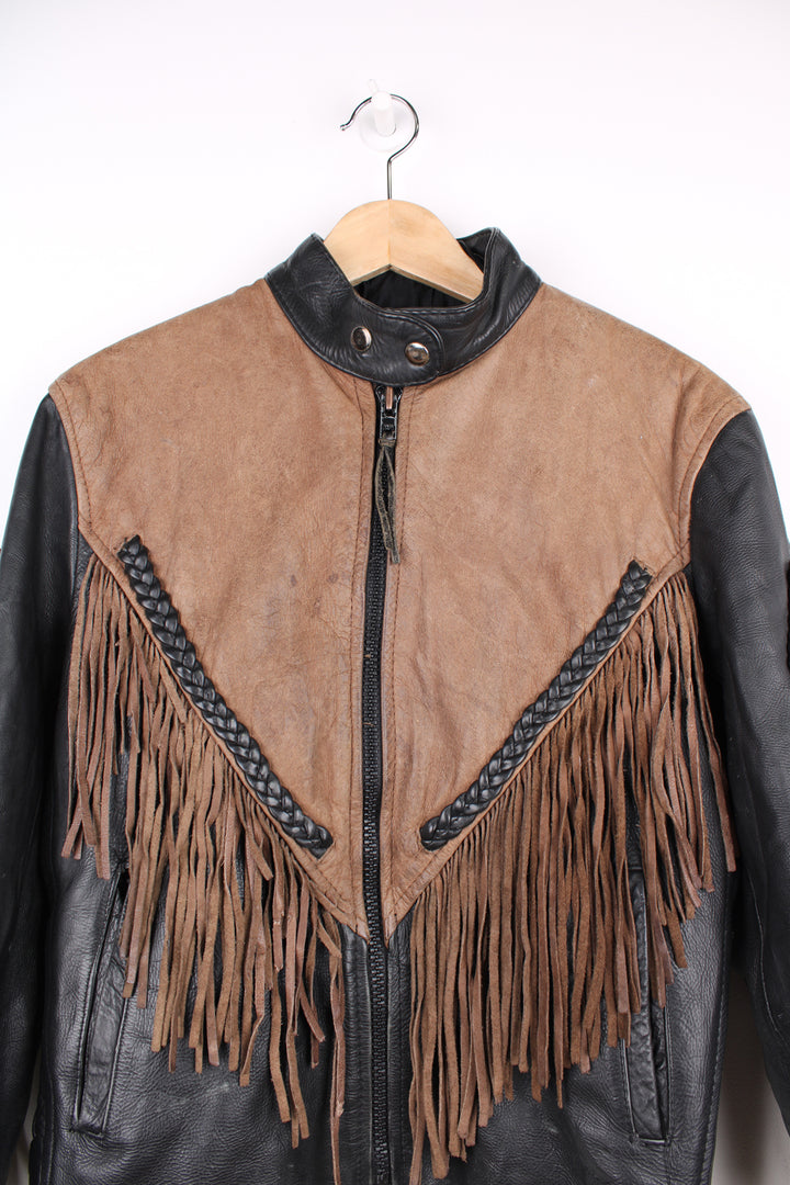 Vintage 80's black and brown fringe motorcycle leather jacket. Features a cropped fit,  fringe detailing on the sleeves and across the back of the shoulder 