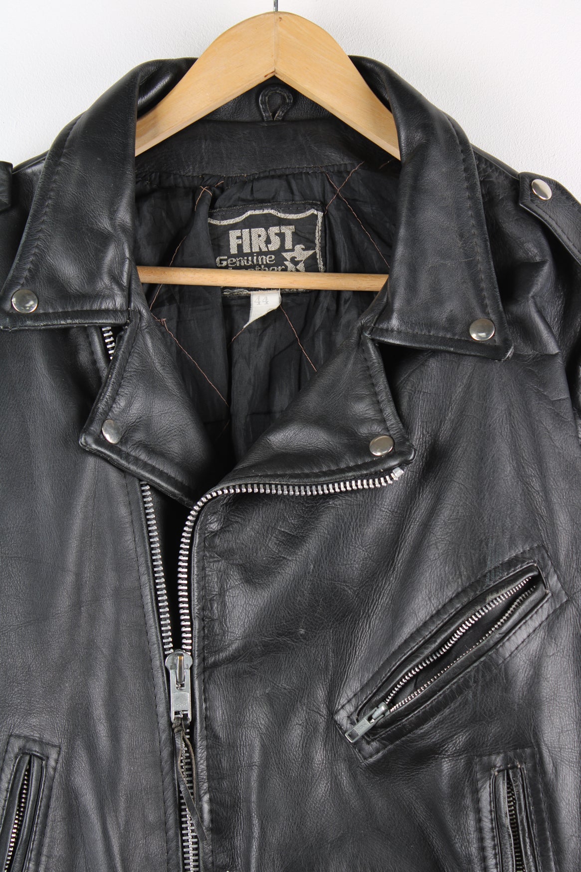 Vintage First biker jacket made from 100% genuine leather, features multiple zip up pockets, lace up details on the hips and chunky belt