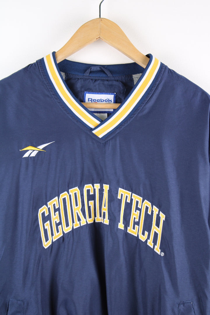 Vintage Reebok, Georgia Tech University sports drill top, blue and yellow team colourway, v neck, side pockets, embroidered logos on the front and back.