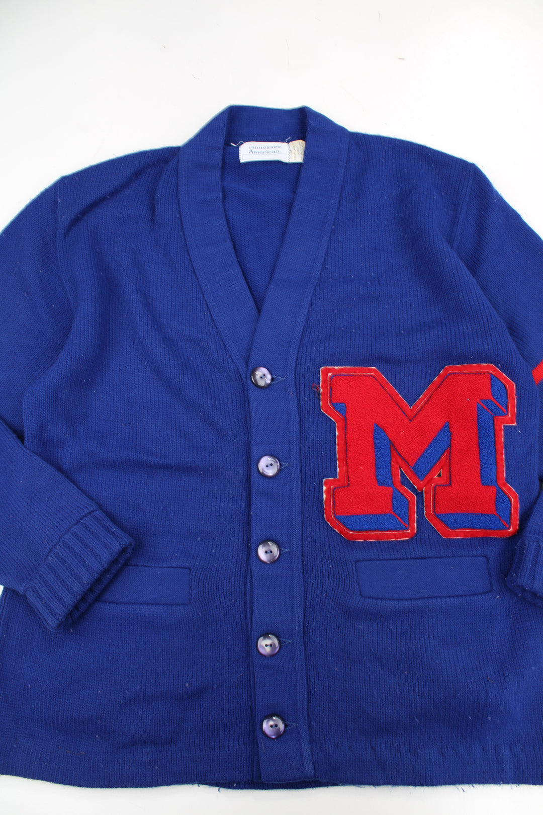 Vintage 100% acrylic wool blue varsity/letterman cardigan, features embroidered badge and pockets 