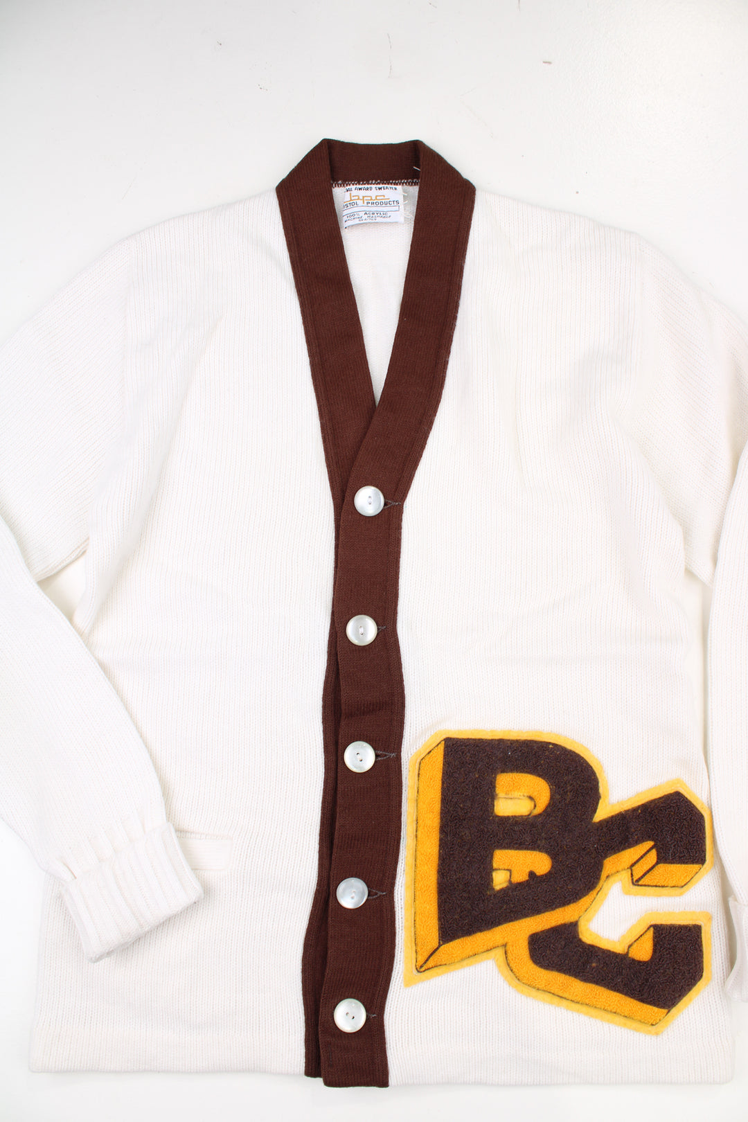 Vintage 1960's Bristol BPC Products 100% acrylic wool white varsity/letterman cardigan, features embroidered badge and pockets