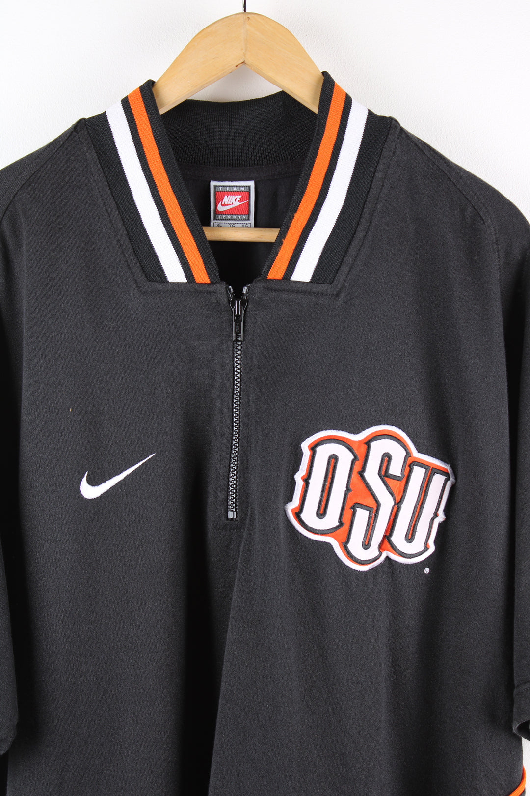 Vintage Ohio State University, Nike training top in the black, orange and white team colourway, quarter zip up with embroidered logos on the front.