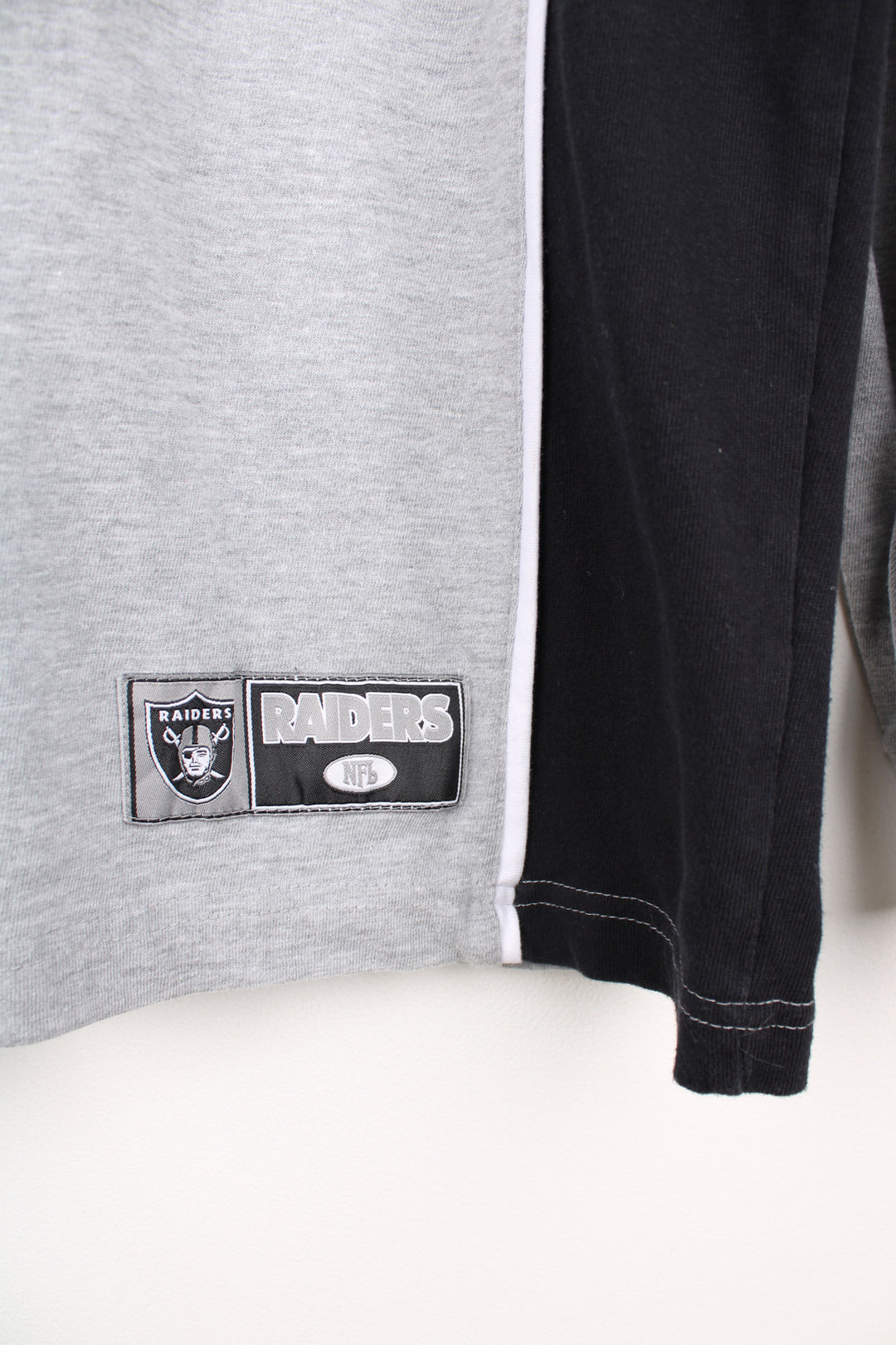 Oakland (now Las Vegas) Raiders grey long sleeve t-shirt made by NFL. Features embroidered logo on the front good condition - Faint mark on the front side (see photos) Size in Label:  Mens L