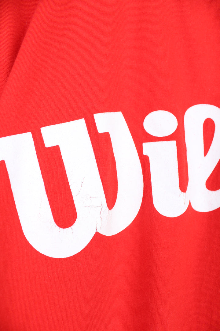 Vintage Wilson T-Shirt in a red and white colourway, crewneck with quarter length sleeves, has logo spell out printed across the front.