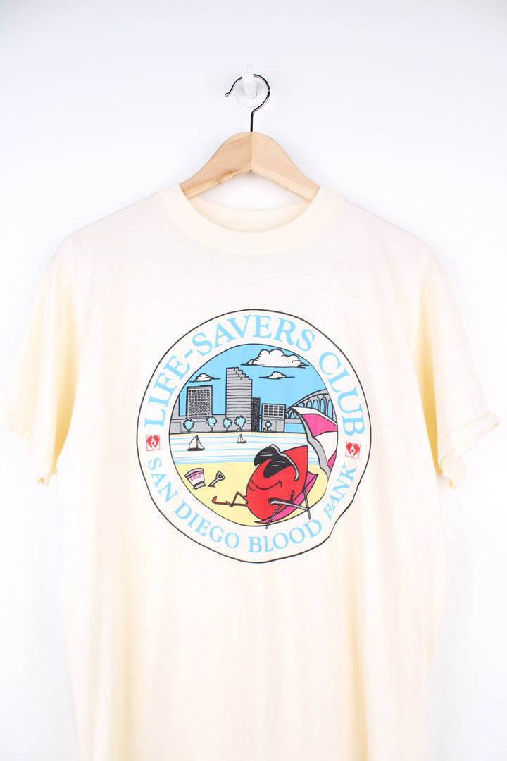 Vintage San Diego Blood Bank, Cartoon Graphic T-Shirt in a tan colourway with graphic design printed on the front, Hanes fifty fifty label and is single stitch.