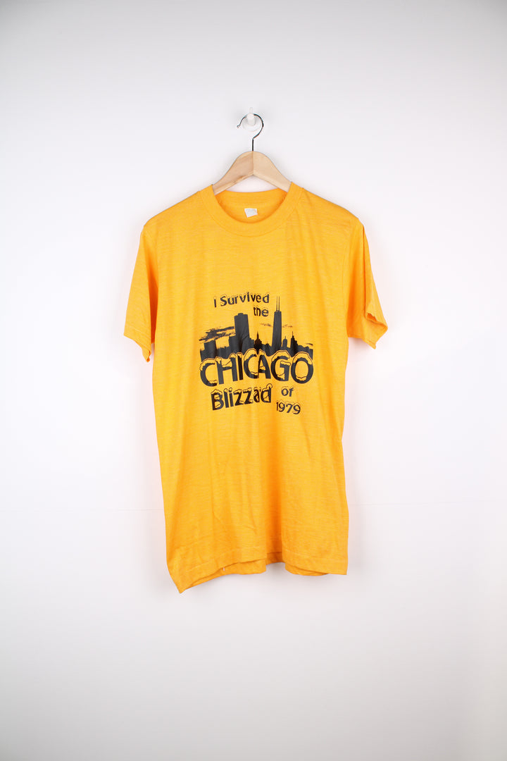 Vintage 70's Chicago Blizzard T-Shirt in a yellow colourway with a slogan graphic design printed on the front, single stitch.