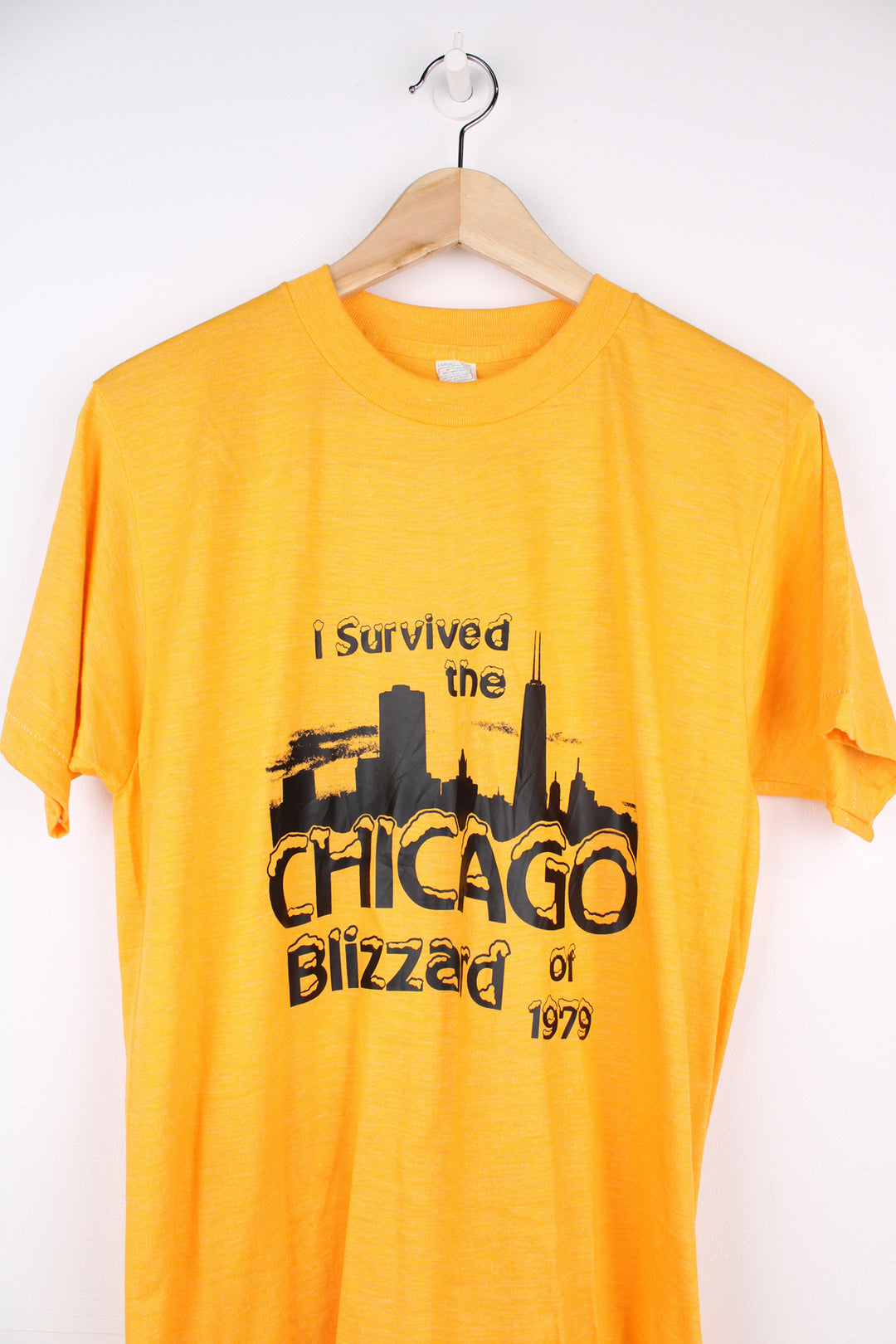 Vintage 70's Chicago Blizzard T-Shirt in a yellow colourway with a slogan graphic design printed on the front, single stitch.