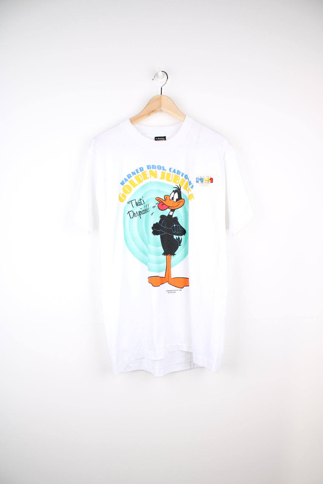 Vintage 1985 Warner Bros Cartoon T-Shirt in a white colourway with big puff print graphic design on the front, deadstock and still has original sticker on the garment.