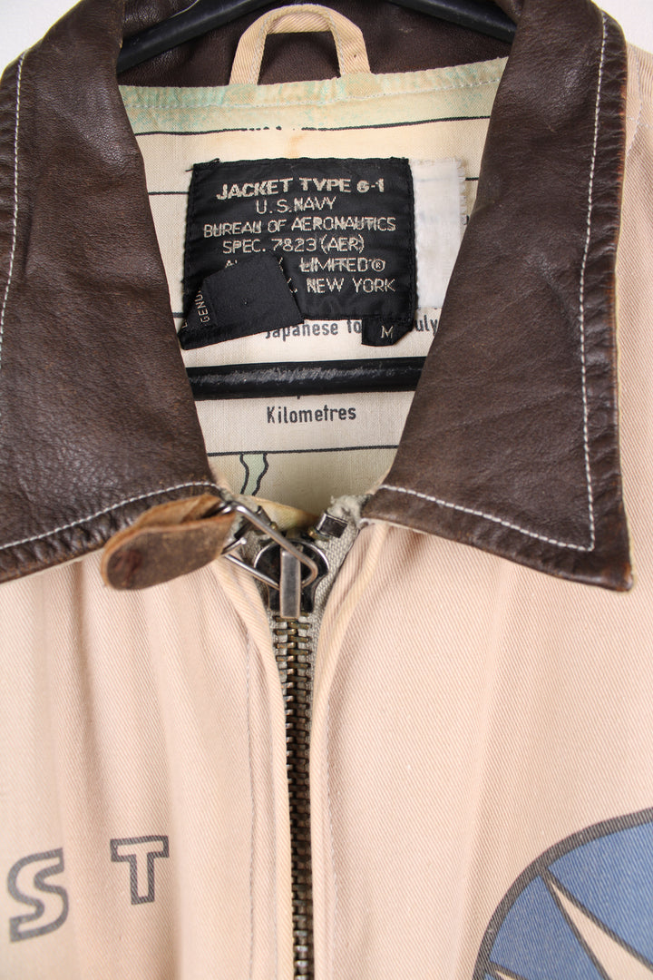 Vintage Avirex type G-1 tan cotton flight jacket with all over printed details and embroidered badge on the pocket