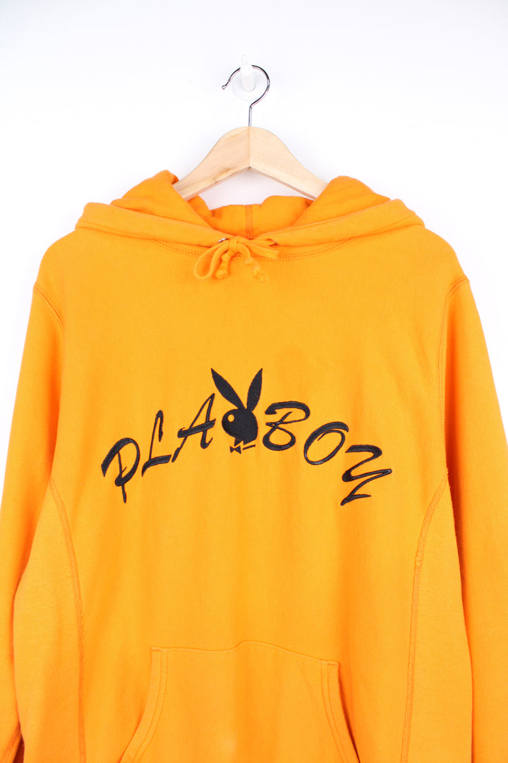 Supreme x Playboy 100% cotton hoodie in orange, made in Canada. Features embroidered spell-out logo across the chest