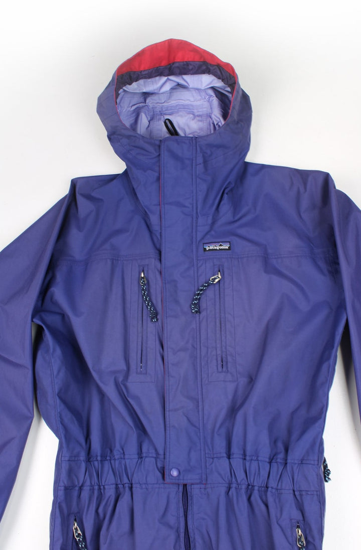 Purple Patagonia ski suit, with elasticated waistband and hood. good condition - Marks on the legs Size in Label: Womens size 12