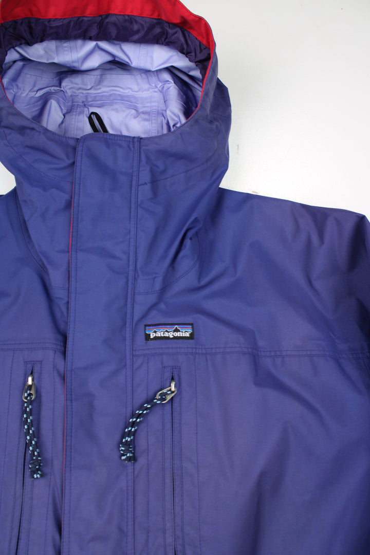 Purple Patagonia ski suit, with elasticated waistband and hood. good condition - Marks on the legs Size in Label: Womens size 12