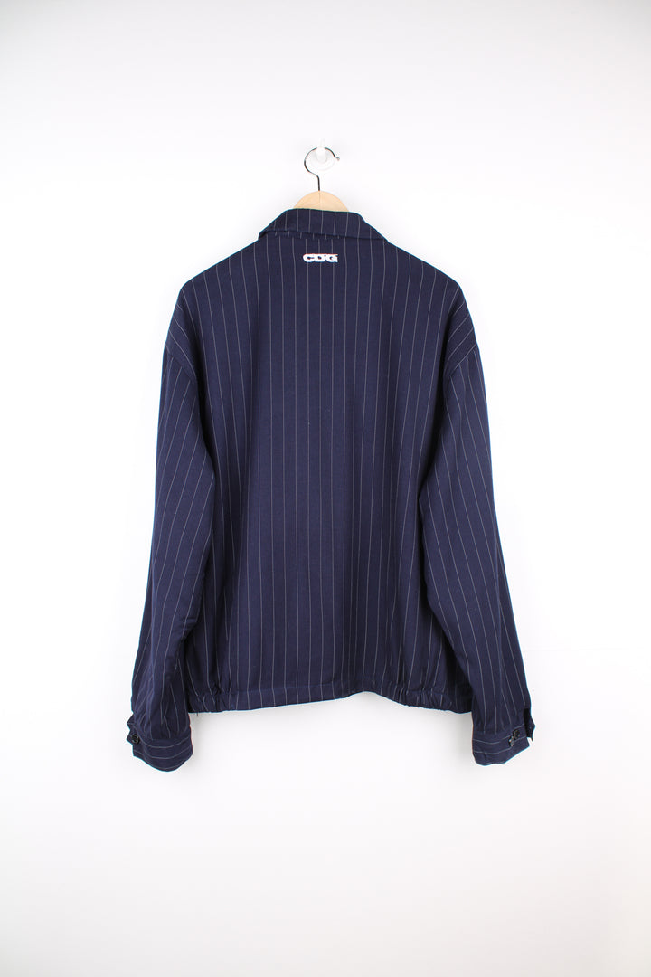 Stussy x Comme Des Garcon blue pinstripe zip through jacket, features embroidered logo on the chest and back of the collar